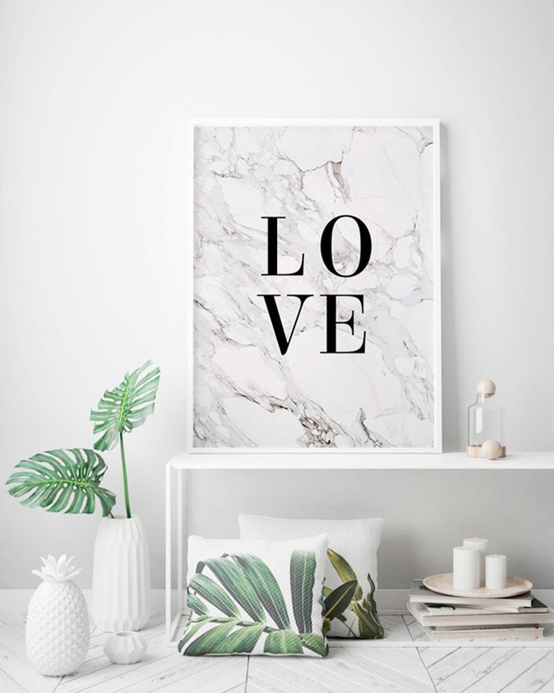 May include: A white framed print with a marble background and the word "LOVE" in black text.