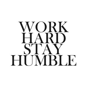 May include: Black and white typography print with the text "WORK HARD STAY HUMBLE".