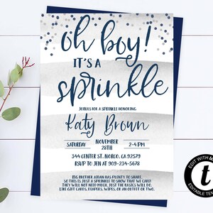 May include: A baby shower invitation with a blue and gray color scheme. The invitation says "Oh Boy! It's a Sprinkle" and includes the name "Katy Brown". The invitation also includes the date, time, and location of the shower.