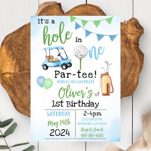 May include: A blue and green golf-themed first birthday party invitation with a golf buggy, golf balls, and golf clubs. The invitation says "It's a hole in one Par-tee! Join us to celebrate Oliver's 1st Birthday Saturday May 14th 2024 2-4pm 2333 Crest Dr. Riverside, CA 92506 Rsvp to Jen at 909-789-4555"