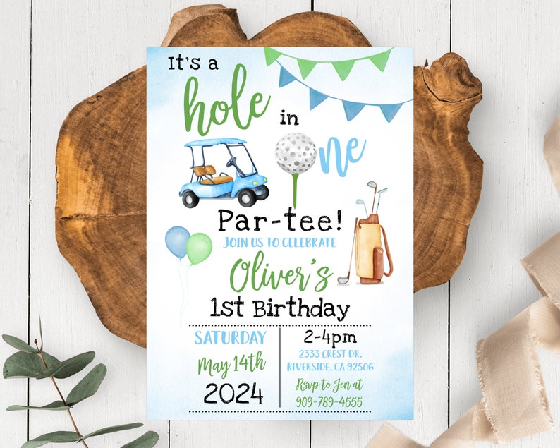 May include: A blue and green golf-themed first birthday party invitation with a golf buggy, golf balls, and golf clubs. The invitation says "It's a hole in one Par-tee! Join us to celebrate Oliver's 1st Birthday Saturday May 14th 2024 2-4pm 2333 Crest Dr. Riverside, CA 92506 Rsvp to Jen at 909-789-4555"