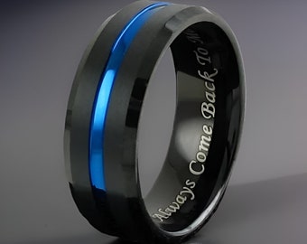 May include: Black tungsten carbide ring with a blue line inlay and the inscription "Always Come Back To Me".