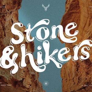 May include: A white font design with the text "Stone & hikers" in a groovy, vintage style. The text is set against a background of two rock formations with a blue sky in the middle.