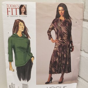 May include: Vogue sewing pattern V1071, Today's Fit by Sandra Betzina, featuring two women's clothing designs. The first design is a green hooded top with long sleeves. The second design is a brown and beige patterned dress with long sleeves.