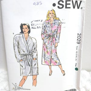 May include: Kwik Sew pattern 2029 for robes, sizes XS-XL. The cover shows illustrations of two robes, one plain and one floral. The price is handwritten as 9.25. Designed by Kerstin Martensson.