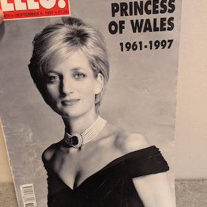 May include: A vintage HELLO! magazine cover from September 6, 1997, featuring a black and white portrait of Diana, Princess of Wales. The text reads THE WORLD MOURNS DIANA PRINCESS OF WALES 1961-1997. The subject wears a multi-strand pearl choker.