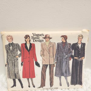 May include: Vogue's Basic Design sewing pattern featuring illustrations of five different coat designs. The pattern cover shows a variety of coat styles in different colors and patterns, including a red coat and a plaid coat.