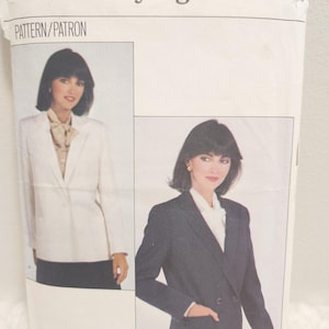 May include: A vintage sewing pattern labelled "Very Easy Very Vogue." The pattern features images of a woman wearing a white blazer and a navy blue blazer. The pattern size is 10.