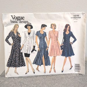 May include: A white Vogue basic design sewing pattern envelope, number 1076, size 6-8-10. The front features five illustrations of dresses and a jacket with various sleeve lengths, necklines, and patterns, including floral, solid, and gingham prints.