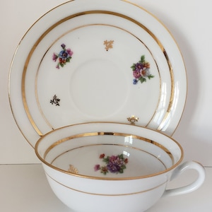 Vintage Limoges Tea Cup and Saucer: Floral Porcelain with Gold Accent