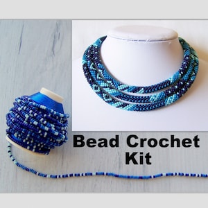 May include: A bead crochet kit with blue, teal, and white beads. The kit includes a spool of beads and a sample of the finished necklace.