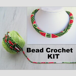 May include: A bead crochet kit for making a watermelon necklace. The kit includes green, red and white beads, and a length of beading thread. Bead Crochet KIT is written on the image.
