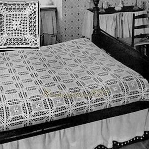 May include: A white, crocheted bedspread with a geometric pattern covers a bed. The bedspread features a repeating square design. A smaller, square crocheted doily is in the upper left corner. The text "Homedecorpattern PDF" is at the bottom.