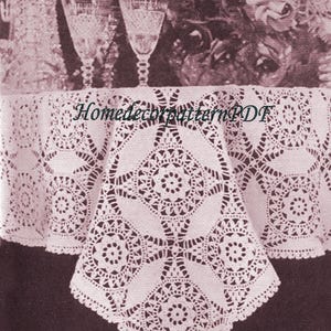 May include: A vintage-style, white crocheted tablecloth with a detailed geometric pattern. The tablecloth is draped over a table, with a pitcher and two glasses visible in the background. The text "HomedecorpatternPDF" is visible on the tablecloth.