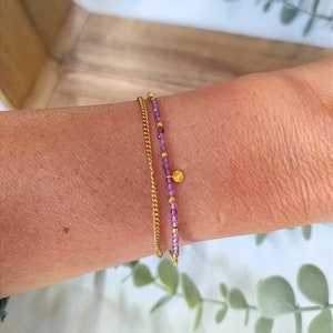 Double chain bracelet with natural amethyst stone and gold-plated sun pendant