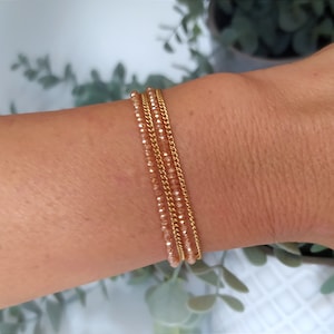 Multi-row bracelet in gold stainless steel chain and champagne crystal beads