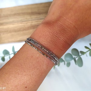 Multi-row stainless steel chain bracelet and green crystal beads