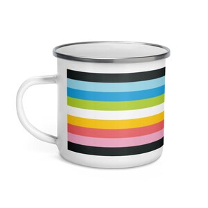 May include: White enamel mug with a colorful striped design. The stripes are black, light blue, green, yellow, pink, and white.