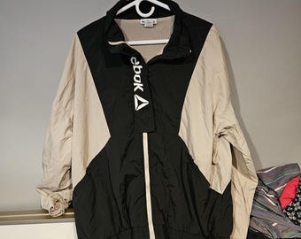 Chaqueta cortavientos Reebok color negro/crema talla XXXL 100% nailon para mujer vintage