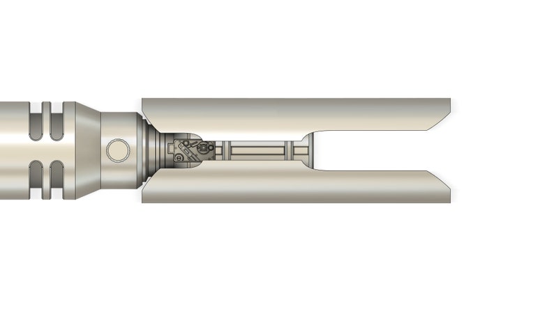 May include: A silver-colored metal object with a cylindrical shape and a series of holes on one end. The object is split in half, revealing a smaller, silver-colored metal object inside.