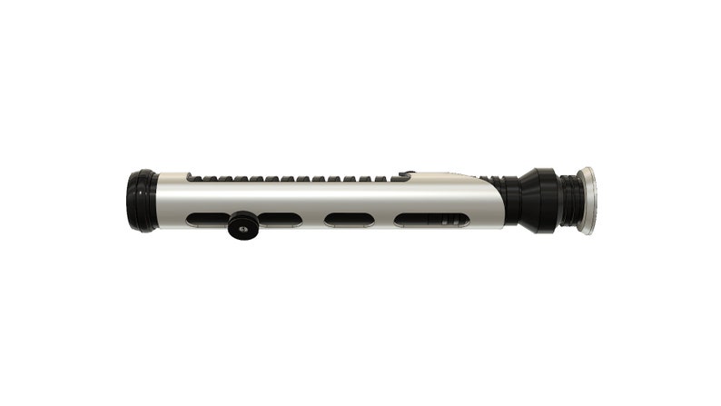 May include: A silver lightsaber hilt with black accents and a textured surface. The hilt has a small black knob on the side.