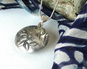 Handmade, sterling silver lentil pendant with floral pattern. Sterling bail, snake chain or black cord. Beautiful gift for her!