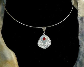 Handmade Silver pendant hanging from a neck wire or chain, hammered texture and Carnelian stone. Birthday gift for Her! Mother's Day Gift!