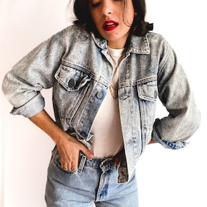 80s vintage acid-washed light blue denim jacket. 3/4 sleeves. Super old school. Made in France.