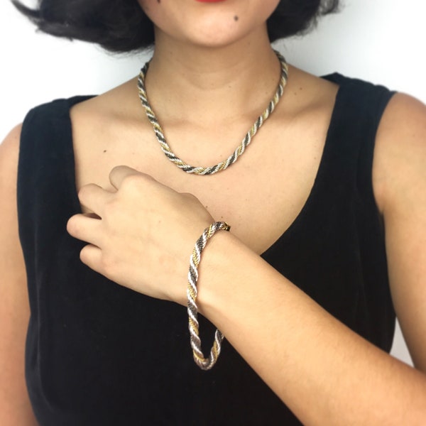 80s vintage necklace and bracelet set, twisted silver, gold plated and ruthenium chain. Hook closure. Very unique! Shipped gift-wrapped.