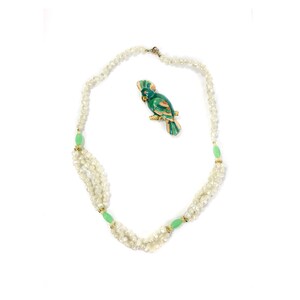 70s vintage pastel parrot brooch and faux-pearl necklace set.