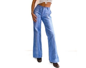 70s vintage light blue slightly weathered denim bell bottom jeans. Retro flare. Quality structure. nylon pockets. Size FR 36 (UK 8, USA 4)