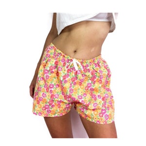 80s/early 90s vintage shorts. Floral print in bright colors with elastic knot at the waist.