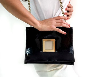 80s vintage black vinyl purse. Metal chain. Perfect size. Glam and rock n' roll.