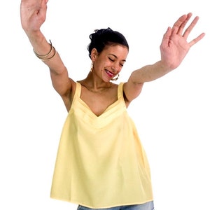90s vintage pale yellow loose tank top with wide straps.