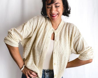 80s vintage cardigan. Pale/pastel yellow. Long, loose sleeves. Very fluid, comfortable knit.
