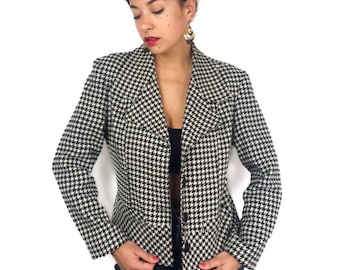 Vintage 80s houdstooth jacket/blazer. Black and cream white in a poly/wool blend. Clean cut. Made in France. Best suits sizes M and L.
