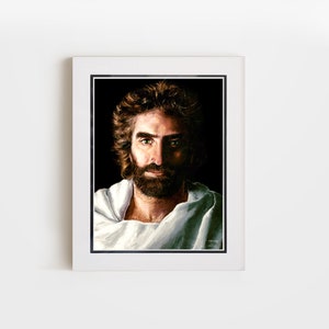 May include: A framed painting of a man with a beard and long hair. He is wearing a white robe and has a serious expression on his face.