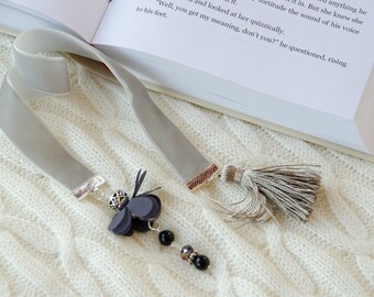 Light grey color velvet ribbon bookmark with flower charm and tassel