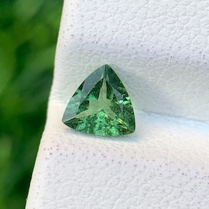 Natural Tsavorite Garnet: 0.44 Carat Trillion Cut Green Gemstone