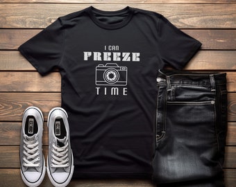 May include: Black t-shirt with a white graphic of a camera and the text "I can freeze time".