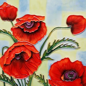 May include: A square tile featuring a vibrant floral design. The artwork showcases several bright red poppies with detailed petals and dark purple centers. Green leaves and stems are also visible against a light blue and yellow background.