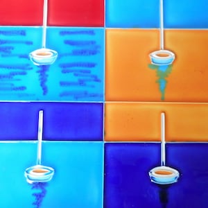 May include: A colorful tile design with four squares. Each square has a different color: red, blue, orange, and a darker blue. A white ladle hangs from the top of each square, with the bowl of the ladle facing down. The ladle is in the center of each square.