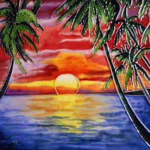 May include: A square ceramic tile featuring a vibrant sunset scene with a bright yellow sun centered above a blue ocean. Silhouetted green palm trees frame the sides against a sky filled with blended gradients of red, orange, and purple hues.