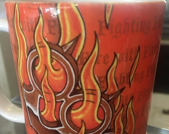 Flaming brass knuckles mug