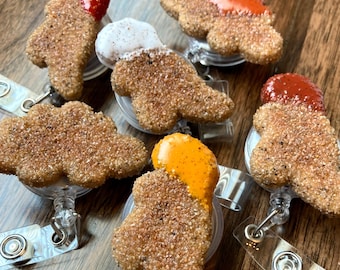Dino Chicken Nugget Polymer Clay Badge Reel with BBQ, Ranch, Sweet and Sour, Honey Mustard, Ketchup, or Hot Sauce