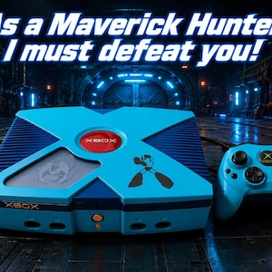 May include: A custom Xbox console and controller in shades of blue, with a red Xbox logo. The console features a Mega Man graphic and the text "As a Maverick Hunter, I must defeat you!" is displayed above the console.