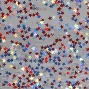 May include: A collection of small, scattered star-shaped sequins in red, blue, and iridescent silver. The stars are distributed across the frame, featuring a reflective, holographic finish that catches the light to create a shimmering effect.