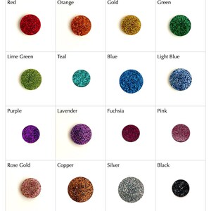 May include: A grid of sixteen circular glitter embellishments in various colors including red, orange, gold, green, lime green, teal, blue, light blue, purple, lavender, fuchsia, pink, rose gold, copper, silver, and black, each labeled with its color name.