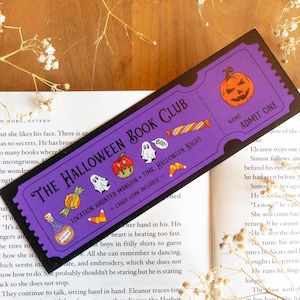 May include: A purple Halloween Book Club bookmark with a ticket design. It features a jack-o'-lantern, candy, ghosts, and the text "The Halloween Book Club" and "Halloween Night".