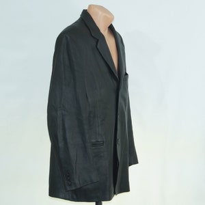 May include: A black leather blazer with a single button closure and two pockets.
